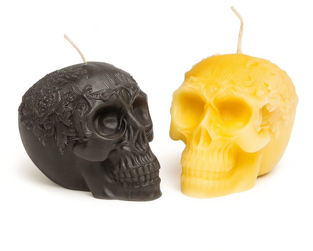 Black and yellow skull-shaped candles on a white background